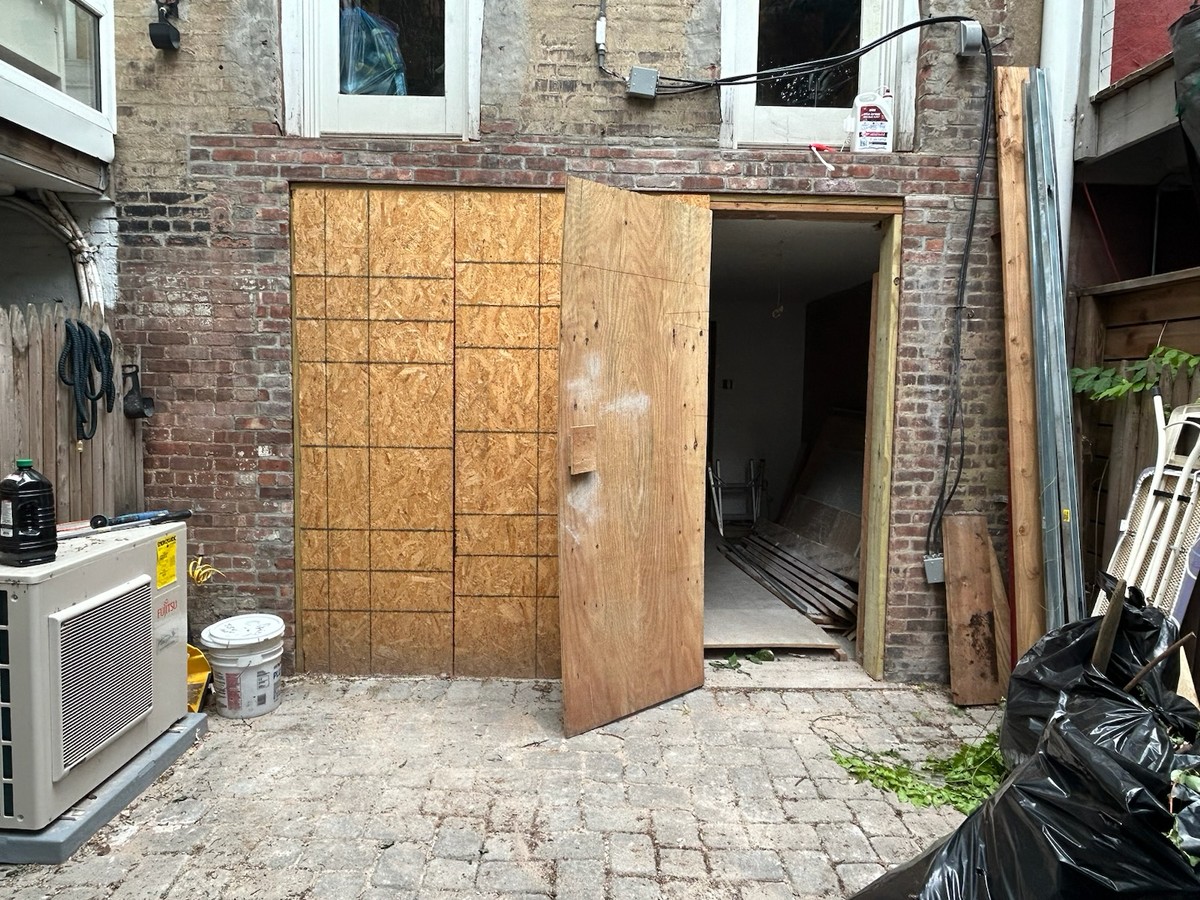 Project step 1: original opening before the folding-door installation