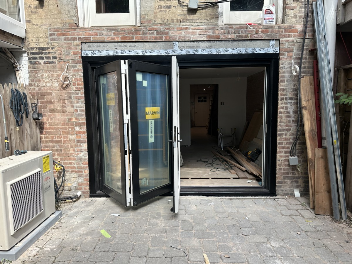 Project step 4: folding-door panels opened during installation