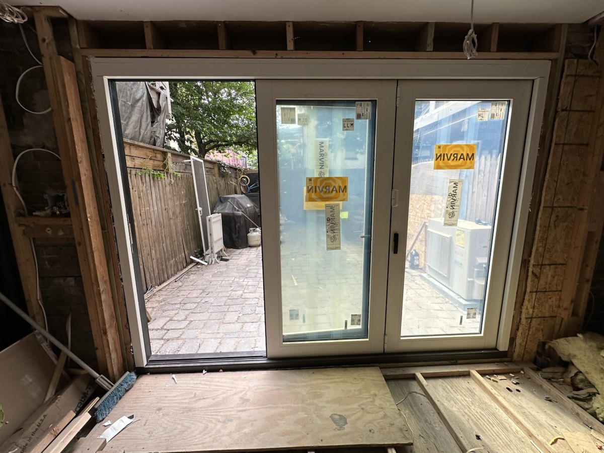 Project step 7: folding-door panels nearly closed from the interior