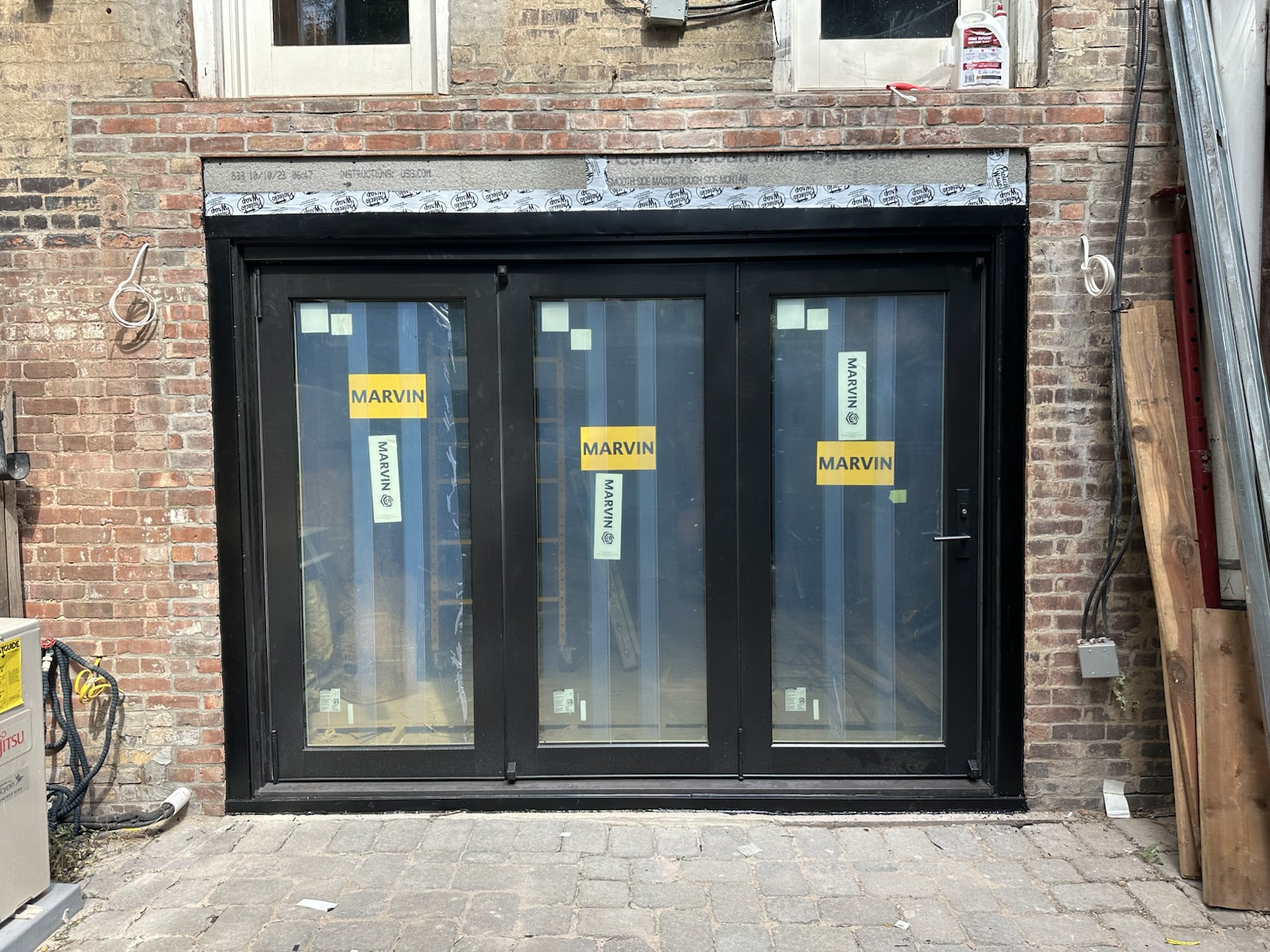 Project step 9: completed folding-door installation viewed from outside